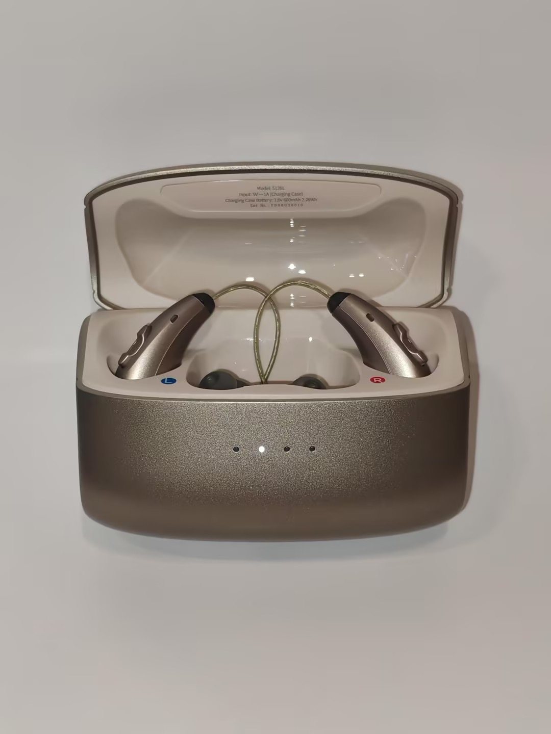 The charging case open, with both Clarion hearing devices seated inside on their magnetic contacts.